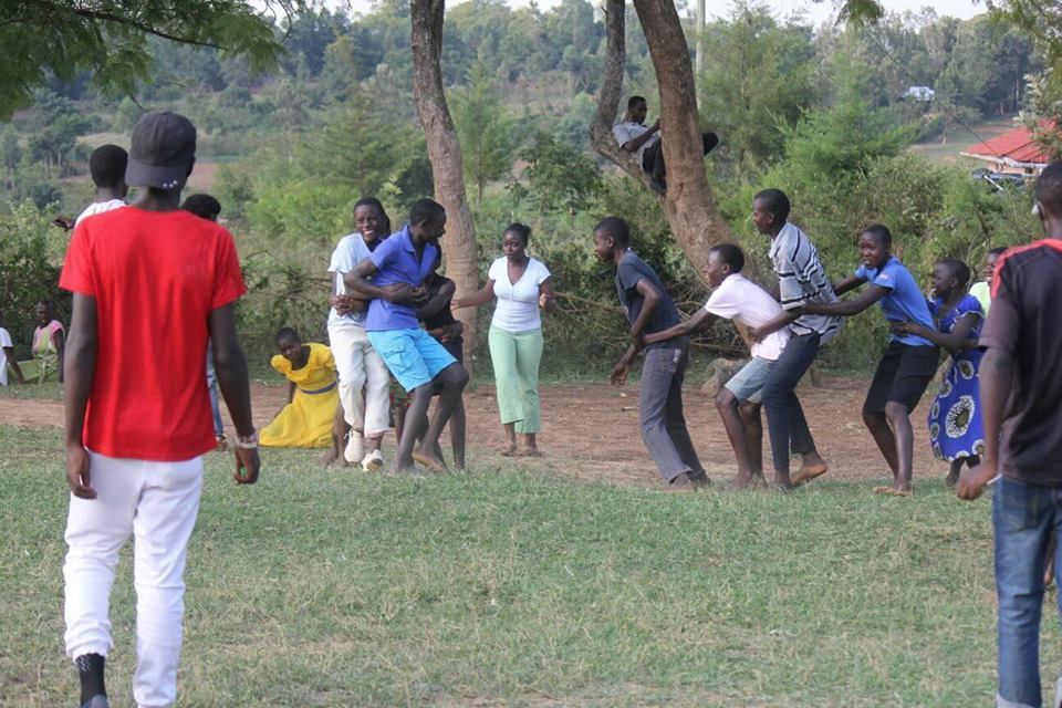 children playing tug-of-war outdoors